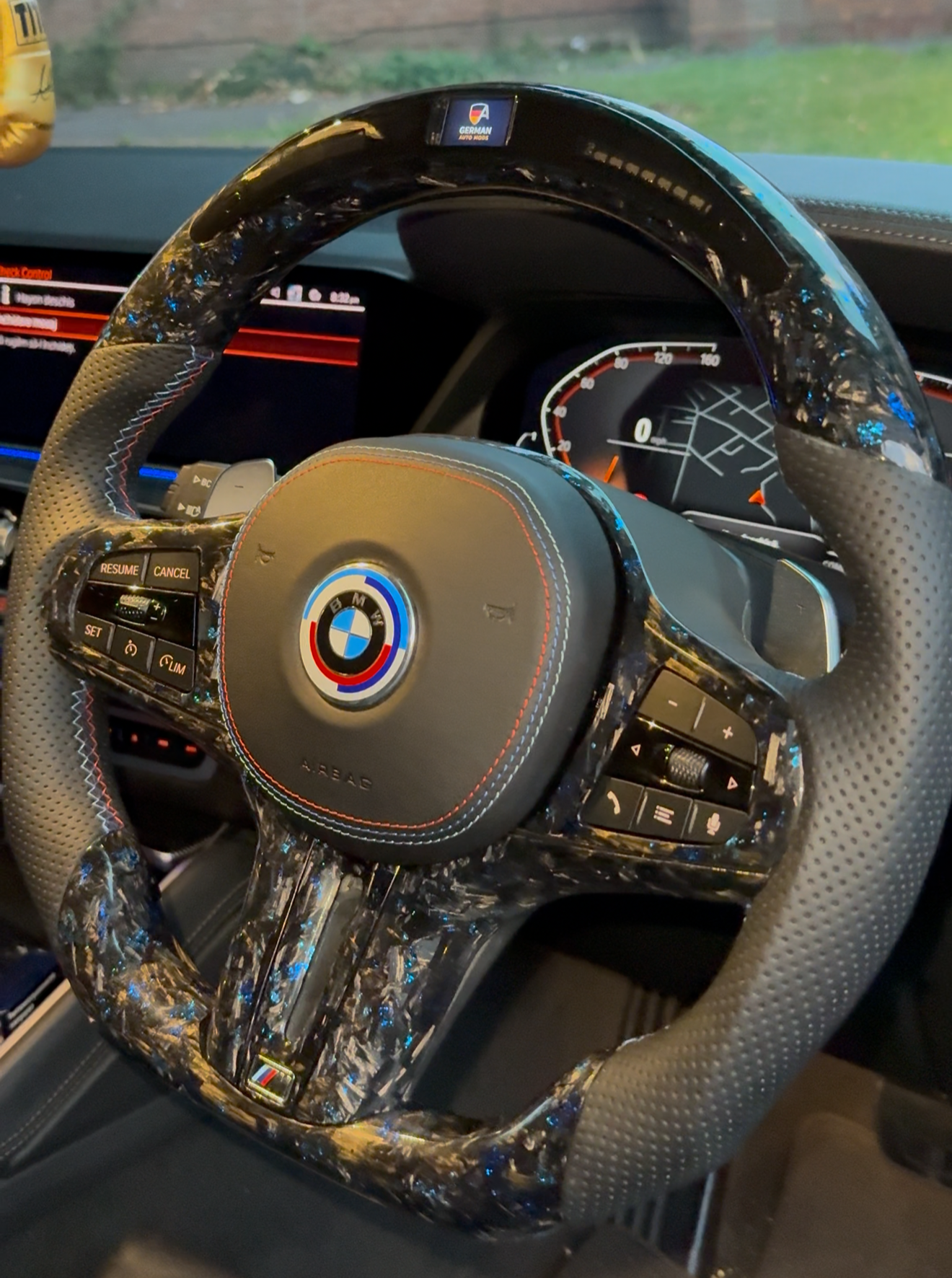 Steering wheel with BMW logo in a car interior